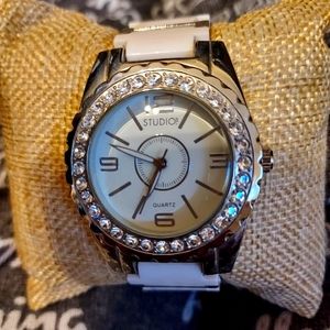 White with crystals ladies watch Just needs a battery.